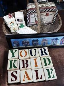lot 25 image: Large Wicker Basket, Set Of Wood Letter Blocks, Small Decorative Box, Whimisical House Print