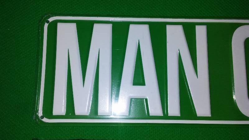 lot 35 image: Man Case Blvd Metal Sign