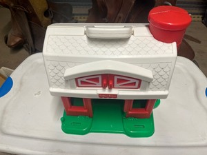 tote full of toy farm animals