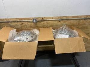 lot 64 image: WHEEL MASTER Lot of 2- Wheel Covers 19-12 Inch Front Wheel With 10 Lug Mounting Hardware