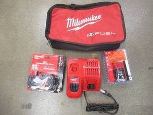 Milwaukee M18 and M12 Batteries, Dual Charger And Bag. SOLD AS IS