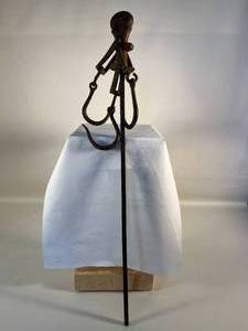 lot 56 image: iron tool (butchers) with hooks & measure