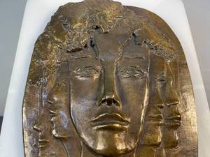 lot 71 image: signed and mounted bronze faces art