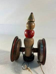 lot 27 image: antique wooden pull-toy on wheels
