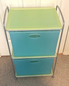 lot 102 image: Pastel Plastic Tote Stand with Totes