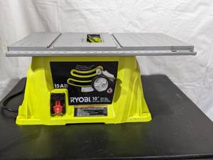 lot 65 image: Two 10 15amp Motor Ryobi Table Saw (1 works other for parts)