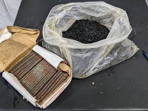 lot 92 image: Large box of Screws and nail gun nails