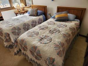 lot 105 image: Twin Beds with Quilts and Bedding