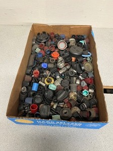 lot 103 image: Flat full of MISC. Caps and Plugs