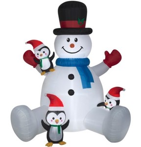 lot 831 image: Home Accents 9.51 ft. Pre-lit Inflatable Snowman with Penguins Climbing Airblown, 1001299559 - SOLD AS IS