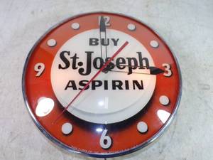 lot 1 image: Very Cool St Joseph Aspirin Pam Clock lights up Hour and minute hand working second hand may just need oiling