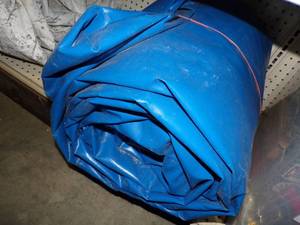 lot 125 image: Large Tarp Good for Woodpile may have rips and holes Blue