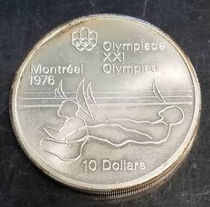 1975 CANADA $10 STERLING SILVER MONTREAL OLYMPIC (1.45 TROY OZ 92.5% SILVER)