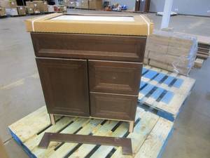 lot 554 image: Home Decorators Collection Sedgewood 30-12 in. Configurable Bath Vanity in Cognac with Solid Surface Top in Arctic with White Sink (BOTTOM FRONT PANEL NEEDS TO BE REATTACHED, CHIP ON SIDE OF CABINET)