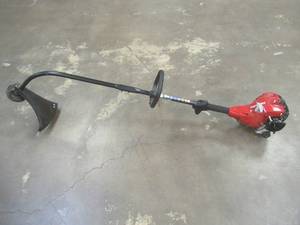 lot 677 image: Homelite2-Stroke 26 cc Straight Shaft Gas Trimmer, ut26csl3vnm, Missing Filter Cover, Has Compression, Could Not Start - SOLD AS IS