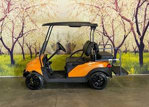 lot 2 image: STREET READY CUSTOM ORANGE GOLF CART