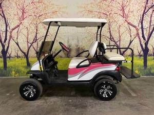 lot 3 image: CUSTOM PINK CLUB CAR GOLF CART