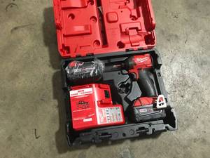 lot 21 image: Milwaukee M18 FUEL 18V Lithium-Ion Brushless Cordless 14 in. Hex Impact Driver Kit with Two 5.0Ah Batteries Charger Hard Case open box customer return see pictures