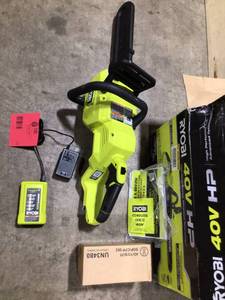 lot 23 image: Ryobi 40V Chainsaw battery and Charger included customer return see pictures