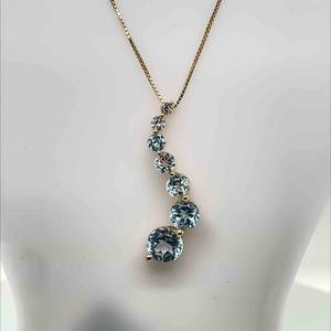 Graduated Curved Round Brilliant Cut Swiss Blue Topaz Journey Pendant in 14k Yellow Gold