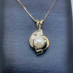 White Pearl & .30ctw. of Fine Diamond Graduating Baguette Swirl Drop Pendant in 14k Yellow Gold VIDEO