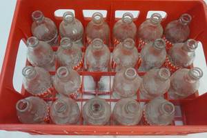 pop shoppe bottles , plastic crate