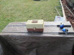 2 fishing rod and reels with a part...