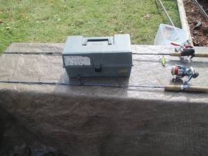 2 fishing rod and reels with a part...