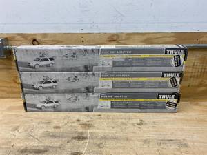 lot 12 image: THULE Lot of 3- Ride On Adapters