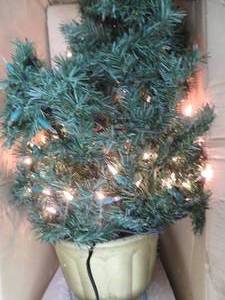 4 PRE LIT SPRUCE IN PLANTER.