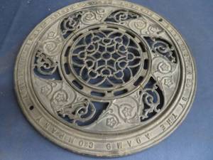 lot 94 image: CAST IRON STOVE COVER