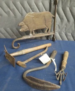 lot 105 image: CAST IRON PIG PLANT HANGER  VINTAGE GARDEN TOOLS