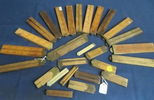 lot 109 image: OVER 20 COLLECTABLE WOODEN RULERS