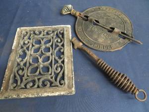 lot 111 image: VINTAGE CAST IRON STOVE ART
