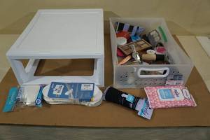 Plastic Storage Drawer with Assorted Makeup and New 3-Pack of Socks