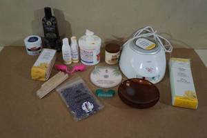 Assorted Personal Care Items -GIGI Home Waxing Kit, Tanning Lotion and Goggles