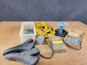 lot 828 image: Extension Cord, Peg Hooks, (2) RaceLux bicycle Seats, Fuel line and More