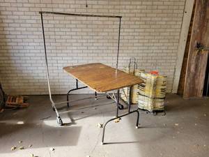 lot 677 image: Rolling Clothing Rack, (2) Stacks of PlasticMetal Hangers on Stands and Folding Table - NO SHIPPING