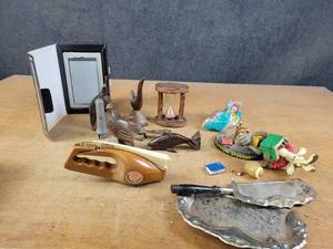 lot 1028 image: Carved Wood Figures, Sony E-Reader, Pocket Fisherman and More