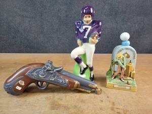 lot 1121 image: (2) Vintage Liquor Decanters - Football Player #7, Pistol Decanter and Golf decanter - NO SHIPPING
