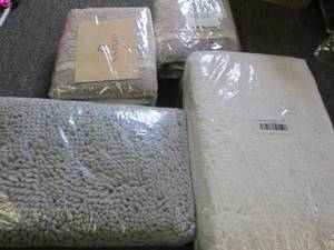 4 sets of new rugs ...