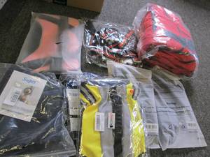 8 new dog harnesses and a life jack...