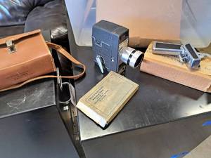 lot 482 image: Vintage Bell & Howell 5mm Camera with Grip, Bulbs, Carry Case