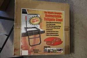 lot 868 image: Retractable Tailgate Step (in original packaging)