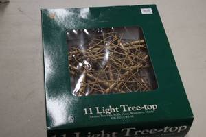 lot 577 image: 9 Wooden 11-light Tree Top Star (in original packaging)