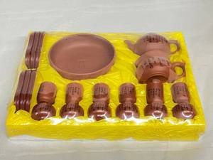 lot 120 image: New In Sealed 21 Piece Package Rare Mid Century Asian Chinese&nbspArt Tang Objects&nbspGlazed Terra Cotta or Red Clay Pottery Snack Luncheon Tea Set With Chinese Characters Design Perhaps For&nbspGungfu Tea Ceremony