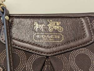 lot 273 image: Dark Brown Coach Wristlet