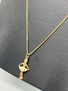 lot 447 image: 10K Ice Skating Figurine Pendant & 14k Chain