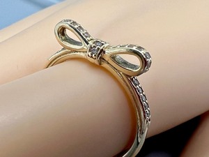 lot 443 image: Pandora 14k Gold and Cubic Zirconia Bow Shaped Ring