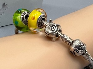 lot 438 image: Pandora Sterling Bracelet with Pandora Charms including Spot the Dog Charm